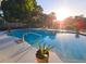 Inviting pool with clear blue water, surrounded by lush greenery under the warm sunlight at 1902 Sarazen Dr, Orlando, FL 32808