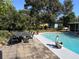 Refreshing pool with surrounding patio, garden and outdoor dining area, perfect for outdoor entertainment at 1902 Sarazen Dr, Orlando, FL 32808