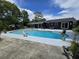 Inviting backyard pool area featuring a clean, well-maintained pool and unique mermaid and swan accents at 1902 Sarazen Dr, Orlando, FL 32808