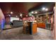 Beautiful bar in a home theater room with beautiful hardwood cabinets and wine cooler at 2000 Bloomsbury Run, Lake Mary, FL 32746