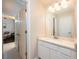 Bathroom with a vanity area and a view of the living room at 2000 Bloomsbury Run, Lake Mary, FL 32746