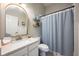 Stylish bathroom featuring a decorative mirror, a toilet, and a decorative shower curtain at 2000 Bloomsbury Run, Lake Mary, FL 32746