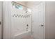Clean bathroom with a shower and tub combo, tiled walls, and a functional design at 2000 Bloomsbury Run, Lake Mary, FL 32746