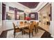 Elegant dining room with a chandelier, wainscoting, and a neutral color palette at 2000 Bloomsbury Run, Lake Mary, FL 32746