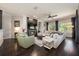 Cozy living room with a fireplace, TV, plush sofas, and elegant decor at 2000 Bloomsbury Run, Lake Mary, FL 32746