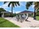 Outdoor patio with a dining table and chairs, bar and pool at 20603 Paddock St, Orlando, FL 32833