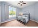 Comfortable bedroom with a light blue walls, carpet flooring and large window at 20603 Paddock St, Orlando, FL 32833