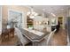 Open-concept dining area with a view into the kitchen and living room, featuring modern decor and natural light at 20603 Paddock St, Orlando, FL 32833