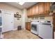 Laundry room featuring a washer and dryer, cabinets, and sink at 20603 Paddock St, Orlando, FL 32833