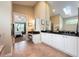 Elegant bathroom with double vanity, tile floors, and a separate makeup area at 20603 Paddock St, Orlando, FL 32833