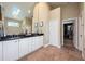 Spacious main bathroom featuring a double vanity, tile flooring, and a skylight at 20603 Paddock St, Orlando, FL 32833