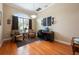 Inviting office with a large window, hardwood floors, and ample natural light at 20603 Paddock St, Orlando, FL 32833