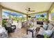 Comfortable covered outdoor kitchen with seating area and plush furniture at 20603 Paddock St, Orlando, FL 32833