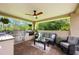 Outdoor kitchen featuring stainless steel grill, outdoor seating and ceiling fan at 20603 Paddock St, Orlando, FL 32833