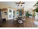 Cozy sun room featuring tile flooring, ceiling fans, and windows for natural light at 20603 Paddock St, Orlando, FL 32833