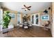 Relaxing sun room with tile flooring, nautical décor, and multiple doors leading to the outdoors at 20603 Paddock St, Orlando, FL 32833
