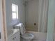 This bathroom has a shower-tub combo, toilet, sink, and vanity with a window at 2112 Lee St, Orlando, FL 32805