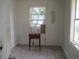 This bedroom features neutral walls and tile flooring with natural light from the windows at 2112 Lee St, Orlando, FL 32805