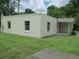 Exterior view of a home showing a well-manicured lawn and a covered entrance porch at 2112 Lee St, Orlando, FL 32805