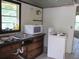 Functional kitchen featuring essential appliances and a well-lit sink area with great light at 2112 Lee St, Orlando, FL 32805