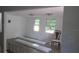 Bright living room with new laminate flooring and natural light streaming in from multiple windows at 2112 Lee St, Orlando, FL 32805
