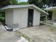 Exterior view of an outbuilding with a concrete slab and open door at 2112 Lee St, Orlando, FL 32805