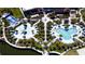 Aerial view showcases a community featuring pools, FlowRider, splash pad, walking trails, and lush landscaping at 2114 Fleming Mist Pl, Kissimmee, FL 34747