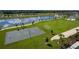 Community aerial view showing the sports fields and lake in a beautiful setting at 2114 Fleming Mist Pl, Kissimmee, FL 34747