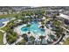 Bird's eye view showcases a beautiful resort-style community pool and surrounding amenities, ideal for leisure at 2114 Fleming Mist Pl, Kissimmee, FL 34747
