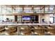 Stylish bar area with modern seating, well-stocked shelves, and a relaxed atmosphere at 2114 Fleming Mist Pl, Kissimmee, FL 34747