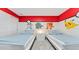 Themed bedroom with twin beds and colorful Pokémon decor, creates a fun and vibrant space at 2114 Fleming Mist Pl, Kissimmee, FL 34747
