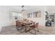 Inviting dining room features modern lighting, seating for six, and decorative wall art for stylish meals at 2114 Fleming Mist Pl, Kissimmee, FL 34747