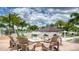 Inviting fire pit area with comfortable seating for outdoor gatherings and relaxation at 2114 Fleming Mist Pl, Kissimmee, FL 34747