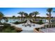 Outdoor area with palm trees, a fire pit, and view of pool and playgrounds at 2114 Fleming Mist Pl, Kissimmee, FL 34747
