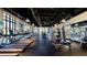Bright fitness center featuring modern equipment, treadmills, weight machines and floor-to-ceiling windows at 2114 Fleming Mist Pl, Kissimmee, FL 34747