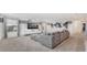 Spacious living room featuring modern gray decor, large TV, and comfortable sectional sofa at 2114 Fleming Mist Pl, Kissimmee, FL 34747