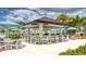 Stylish outdoor bar with ample seating and a shaded canopy, perfect for socializing at 2114 Fleming Mist Pl, Kissimmee, FL 34747