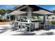 Elegant outdoor bar with seating and modern design, perfect for entertaining poolside at 2114 Fleming Mist Pl, Kissimmee, FL 34747