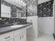 Bathroom featuring black-and-white wallpaper at 2151 Conifer Ave, Winter Park, FL 32792