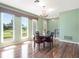 Bright dining room area featuring hardwood floors and large windows for natural light at 2151 Conifer Ave, Winter Park, FL 32792