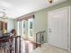 Welcoming foyer showcasing the front door and staircase with iron banister at 2151 Conifer Ave, Winter Park, FL 32792