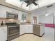 Well-equipped kitchen featuring stainless steel appliances and ample cabinet space at 2151 Conifer Ave, Winter Park, FL 32792