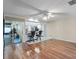Open living space features hardwood floors, ceiling fan, and sliding glass doors at 2151 Conifer Ave, Winter Park, FL 32792