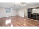 Living room featuring hardwood floors, natural light from window, and ample space at 2151 Conifer Ave, Winter Park, FL 32792