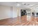 Spacious living room with hardwood floors, ceiling fan, and built-in shelving at 2151 Conifer Ave, Winter Park, FL 32792