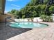 Private backyard featuring a refreshing in-ground pool and brick-paved patio area at 2151 Conifer Ave, Winter Park, FL 32792