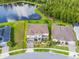 Expansive home showcasing a large lot, meticulously landscaped yard, and tranquil lake views at 2275 Pearl Cider St, Orlando, FL 32824