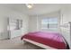 Bright bedroom with white furnishings, plush carpet, and a window bringing in lots of natural light at 2275 Pearl Cider St, Orlando, FL 32824