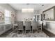 Elegant dining room featuring stylish chandelier, neutral decor, and a large mirror accent at 2275 Pearl Cider St, Orlando, FL 32824