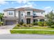 Beautiful two-story home with stone accents, a two-car garage, and a professionally landscaped yard at 2275 Pearl Cider St, Orlando, FL 32824